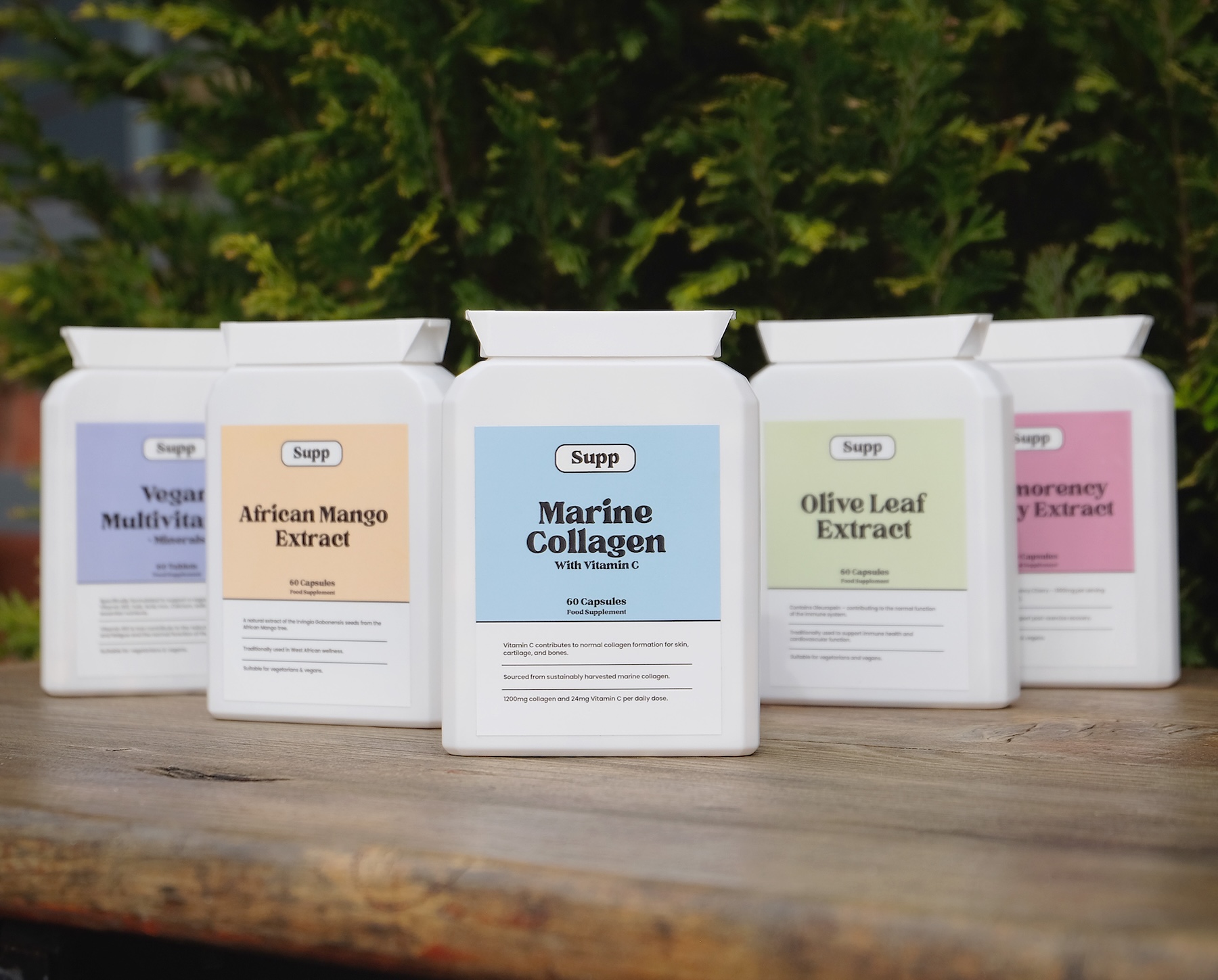 outside line up Five Supp products shown on wood outside.