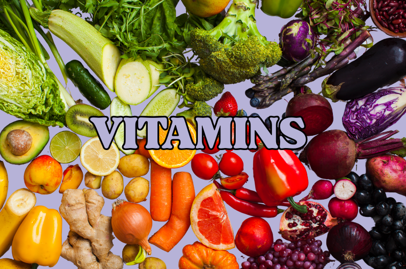 Fresh fruit and veg with the word vitamins over the top