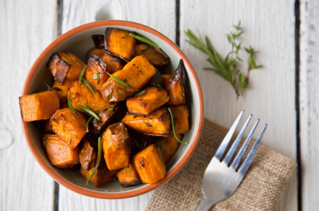 A bowl of roasted sweet potatoes.