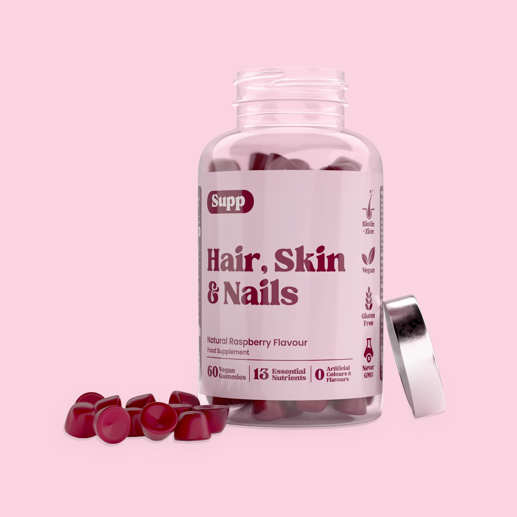 Supp Hair Skin & Nails lid off gummies by side Supp Hair Skin & Nails bottle with lid off and a few gummies by the side of the bottle.
