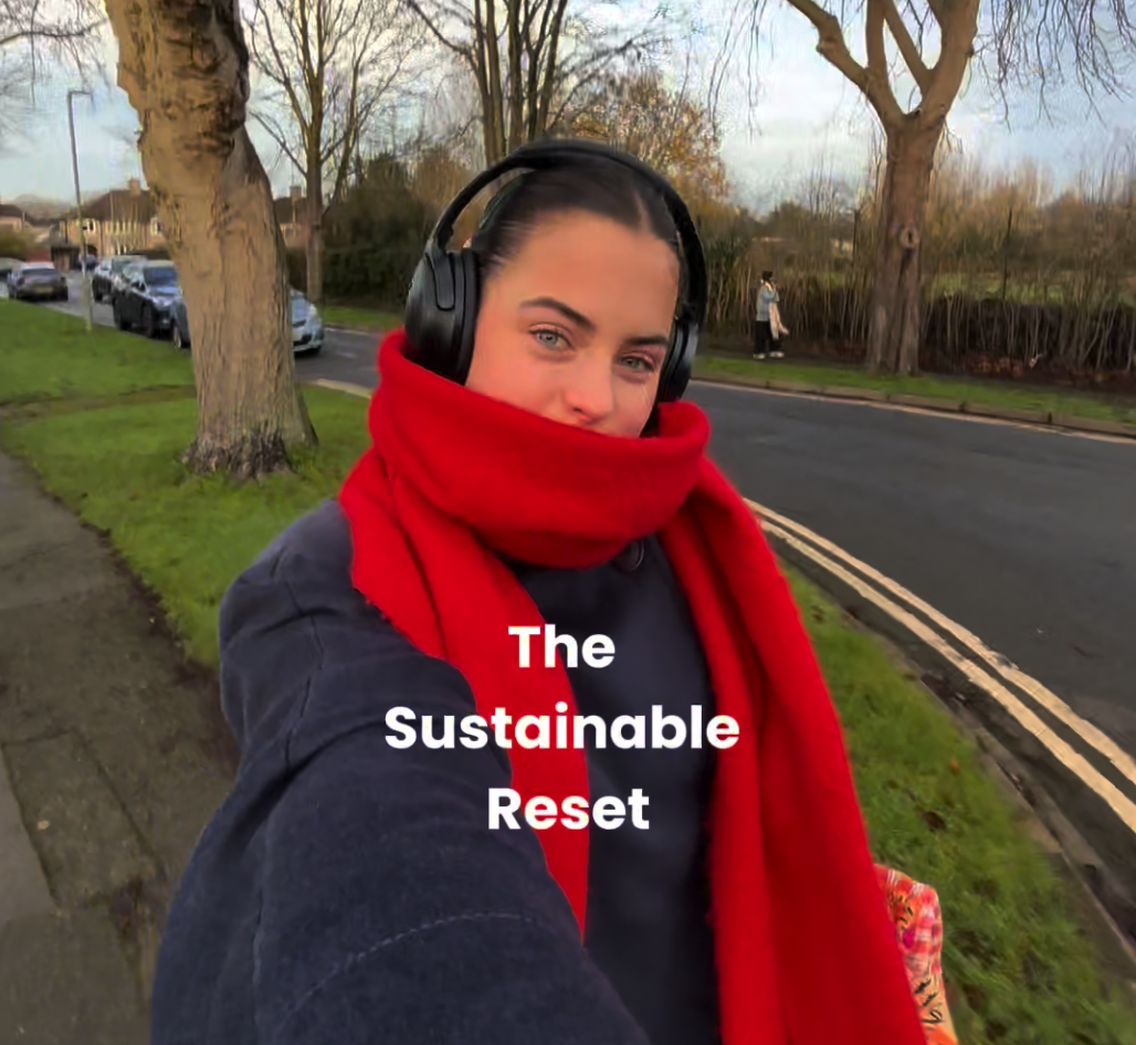 Girl outside with headphones and scarf on. Text reading "the sustainable reset"